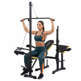 Black and yellow weight bench with squat rack on a white background