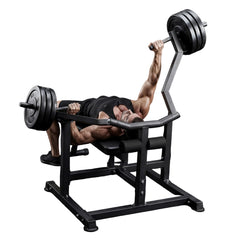 Person using a weight machine with text about independently leveraging arms for safer bench push.