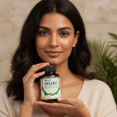 Bottle of NutraNourished Organic Moringa capsules on a white background