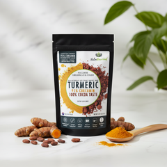 Turmeric supplement package with turmeric roots and a spoonful of powder on a light background