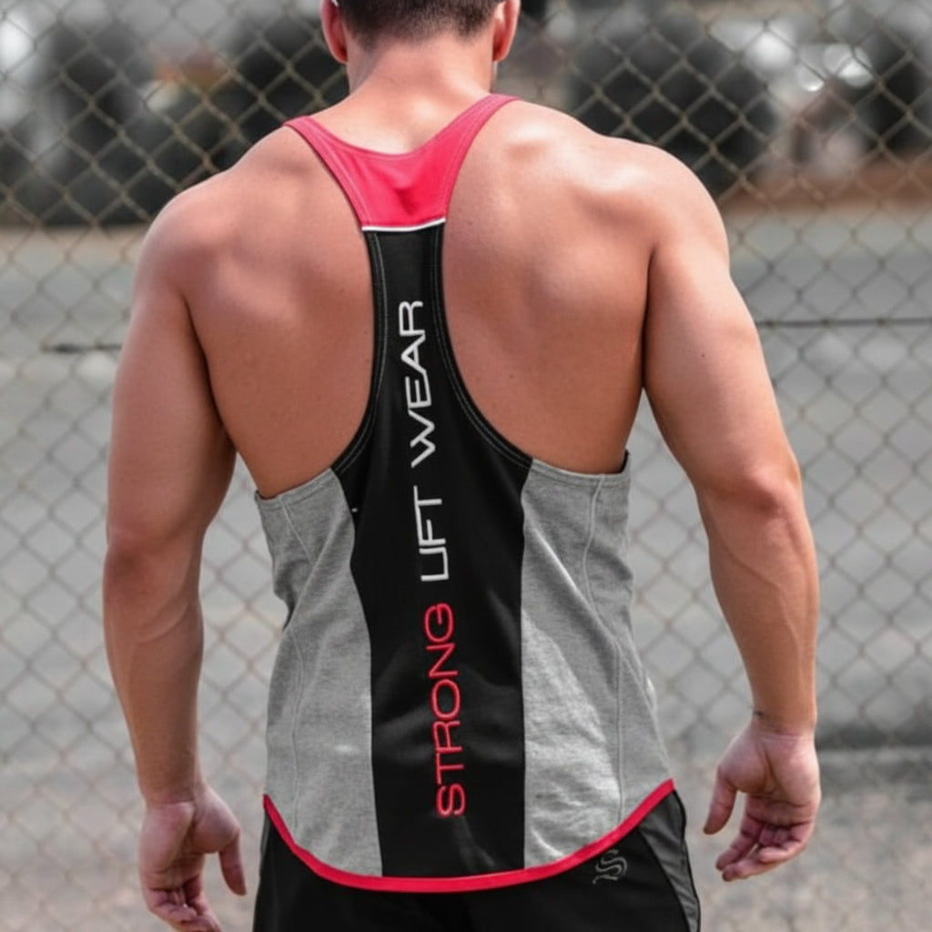 Person wearing a gray tank top with 'Strong Lift Wear' branding, showcasing tattoos on arms and back.