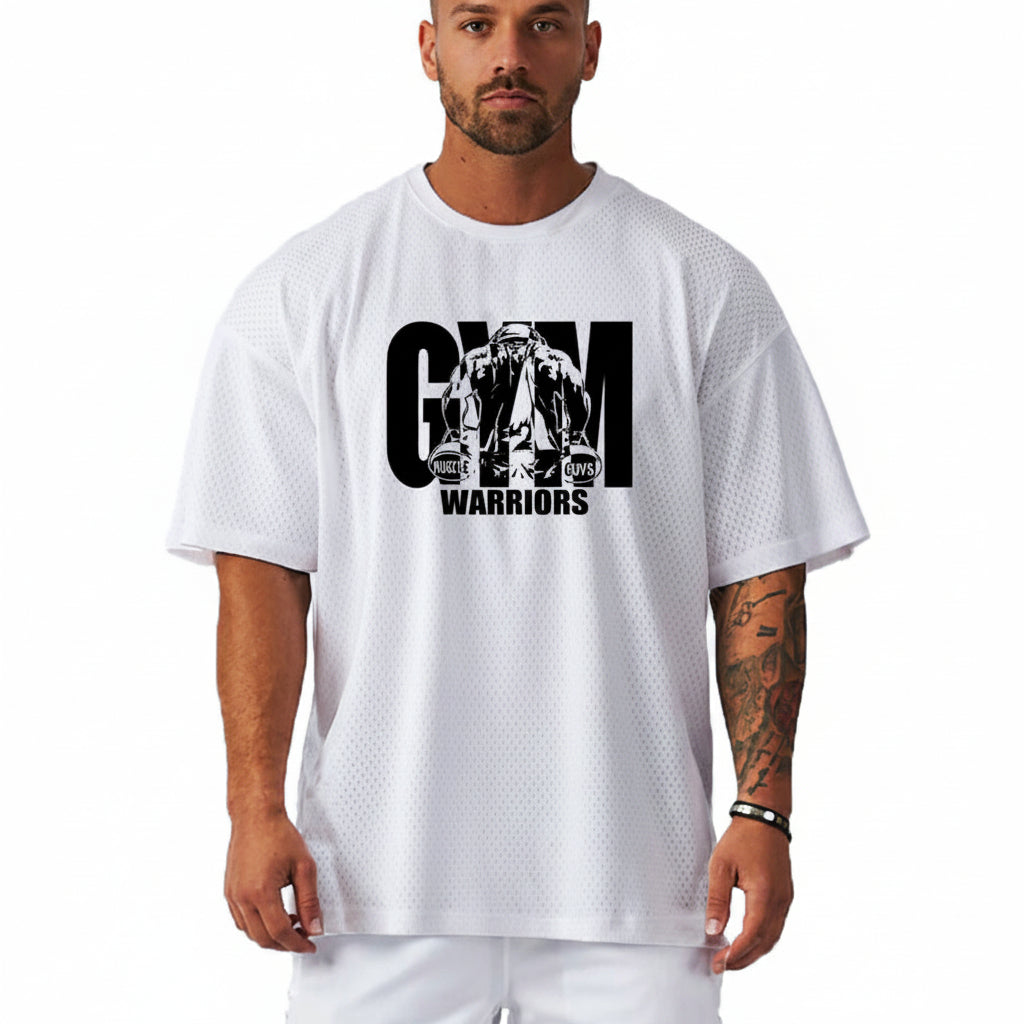 Person wearing a white t-shirt with 'Gym Warriors' graphic design on a plain background